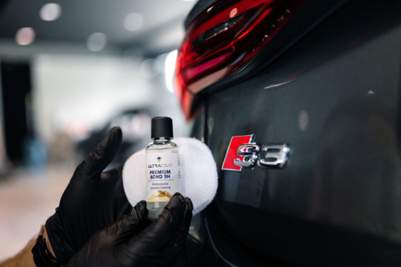 Ceramic coating protecting car paint from water and dirt