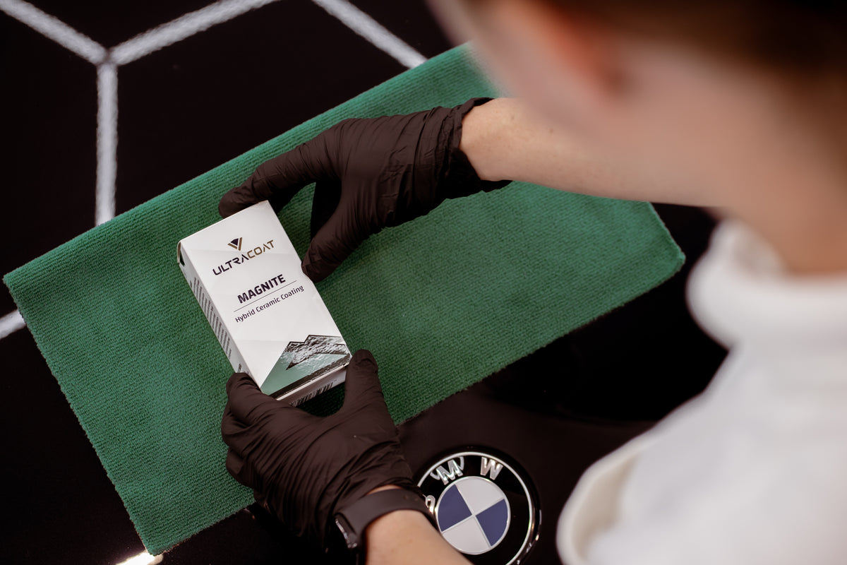 Ultracoat Magnite hybrid ceramic coating box on a microfibre towel laid over a car bonnet