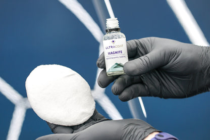 Ultracoat Magnite bottle held next to a microfibre applicator pad, ready to apply