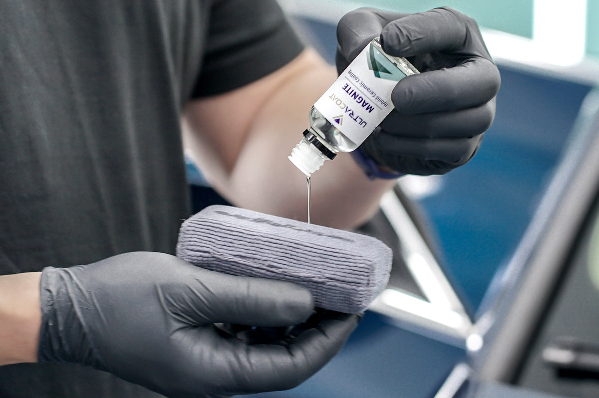 Pouring Ultracoat Magnite onto a suede applicator block before coating the paint