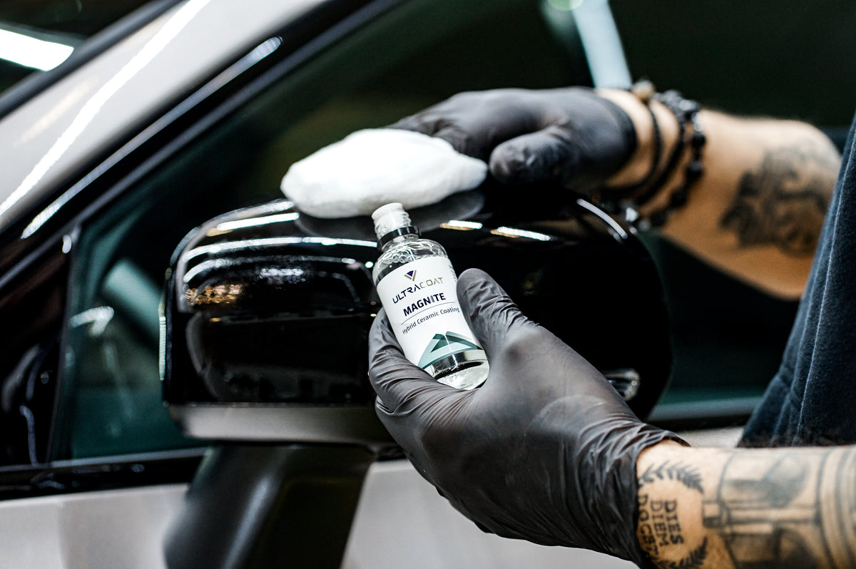 Ultracoat Magnite ceramic coating being applied to a gloss black wing mirror