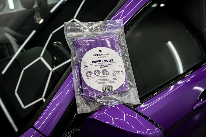 Ultracoat Purple Blaze edgeless microfibre on a purple sports car panel with hexagon decals — representing the Ultracoat accessories range